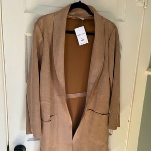 Light camel-colored long blazer-like jacket.